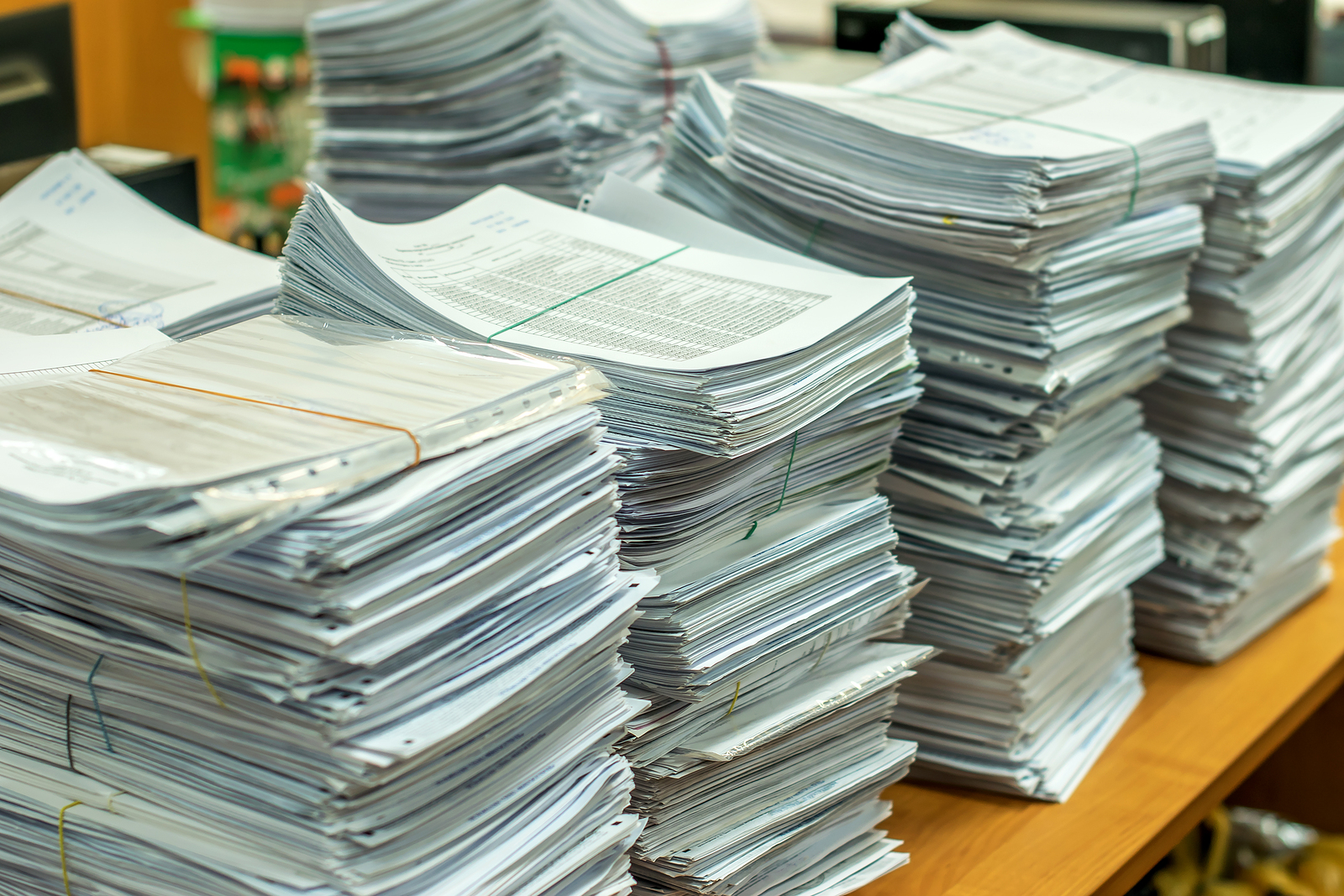 Bundles Bales Of Paper Documents. Stacks Packs Pile On The Desk